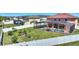 Aerial view of backyard with an enclosed pool, lush lawn, and privacy fence at 2629 Maggiore Cir, Kissimmee, FL 34746