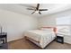 Cozy bedroom featuring neutral tones, comfortable bedding, and a ceiling fan at 2629 Maggiore Cir, Kissimmee, FL 34746