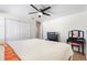 Spacious bedroom featuring comfortable bedding, a ceiling fan, and a vanity at 2629 Maggiore Cir, Kissimmee, FL 34746