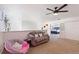 Spacious bedroom featuring neutral carpeting and an open doorway at 2629 Maggiore Cir, Kissimmee, FL 34746
