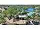 Aerial view showcasing the community playground, swimming pool, and lake views, perfect for Gathering enjoyment at 2629 Maggiore Cir, Kissimmee, FL 34746