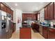Spacious kitchen featuring dark cabinetry, stainless steel appliances and tiled floors at 2629 Maggiore Cir, Kissimmee, FL 34746