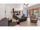 A bright living room offers views to the kitchen, dining and pool at 2629 Maggiore Cir, Kissimmee, FL 34746