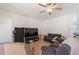 A casual living room with neutral walls and a ceiling fan at 2629 Maggiore Cir, Kissimmee, FL 34746