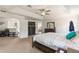 Bright main bedroom with neutral carpet, ceiling fan, and ensuite access at 2629 Maggiore Cir, Kissimmee, FL 34746