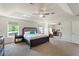 Spacious main bedroom with tray ceiling, carpet flooring, and ample natural light at 2629 Maggiore Cir, Kissimmee, FL 34746