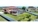 Fenced-in backyard with enclosed pool, lush lawn, and tropical landscaping offering a private outdoor oasis at 2629 Maggiore Cir, Kissimmee, FL 34746