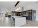 Modern kitchen with white island, stainless steel appliances, and an open layout to the dining area at 2877 Ashton Ter, Oviedo, FL 32765