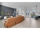 Open-concept living space with hardwood floors, fireplace, and view of dining area and front entry at 2877 Ashton Ter, Oviedo, FL 32765