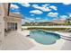 Gorgeous backyard pool area with a spa, sun loungers, and meticulous landscaping at 2877 Ashton Ter, Oviedo, FL 32765