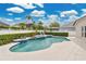 Backyard pool with in-ground spa and lush landscaping for serene outdoor living at 2877 Ashton Ter, Oviedo, FL 32765