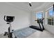 Bright workout room featuring a treadmill, stationary bike and luxury vinyl plank flooring at 2877 Ashton Ter, Oviedo, FL 32765
