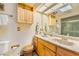 Well-lit bathroom with double sinks, a large mirror, and a shower/tub combination at 300 Radebaugh Dr, Longwood, FL 32779