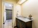 Elegant bathroom featuring a marble countertop, dark vanity, and a glass-enclosed shower at 300 Radebaugh Dr, Longwood, FL 32779