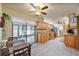 Spacious eat-in kitchen with wood cabinets, granite countertops, and sliding door to screened patio at 300 Radebaugh Dr, Longwood, FL 32779