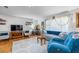 Cozy living room featuring hardwood floors, neutral colors, and a large window at 300 Radebaugh Dr, Longwood, FL 32779