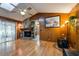 Living room features a stone fireplace, hardwood floors, and wood paneled walls at 300 Radebaugh Dr, Longwood, FL 32779