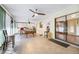 Spacious sunroom with a pool table, bar stools, and sliding glass doors at 300 Radebaugh Dr, Longwood, FL 32779