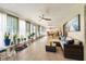 Bright sunroom with a pool table, comfortable seating, and lots of natural light at 300 Radebaugh Dr, Longwood, FL 32779