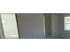 A bedroom features an open wall where the bed will be placed and natural light at 30108 Misty Pines Rd, Mount Dora, FL 32757