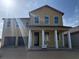 Two story home with large windows and a two car garage is bathed in sunlight at 30108 Misty Pines Rd, Mount Dora, FL 32757