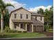 Charming two-story home with covered entryway and attached two-car garage at 30108 Misty Pines Rd, Mount Dora, FL 32757