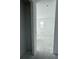 A hallway features natural light and is awaiting finishes at 30108 Misty Pines Rd, Mount Dora, FL 32757