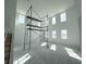 Bright living room featuring multiple windows at 30108 Misty Pines Rd, Mount Dora, FL 32757