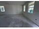 A large living room with natural light is ready for finishes at 30108 Misty Pines Rd, Mount Dora, FL 32757