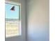 A bedroom with a clear window and neutral walls showing great natural light for this space at 30162 Rustic Mill St, Mount Dora, FL 32757