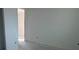 A light filled bedroom with neutral walls and flooring featuring access to other areas of the home at 30162 Rustic Mill St, Mount Dora, FL 32757