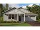 Charming home featuring a two-car garage, landscaped yard, and stylish architectural details at 30162 Rustic Mill St, Mount Dora, FL 32757