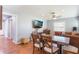 Dining room featuring hardwood floors, an adjacent living room and lots of natural light at 311 E Wallace St, Orlando, FL 32809