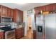Modern kitchen featuring stainless steel appliances, granite countertops, and stylish cabinets at 311 E Wallace St, Orlando, FL 32809