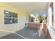 Enclosed porch area with brick accents and a door with a pet entrance at 311 E Wallace St, Orlando, FL 32809