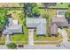 Aerial view of a home with a well-maintained lawn, landscaping and neutral roof at 3420 Arnel Dr, Winter Park, FL 32792