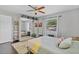 Bright bedroom with hardwood floors, large mirrored closet, comfortable bed, and modern decor at 3420 Arnel Dr, Winter Park, FL 32792