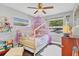 Charming ' bedroom features a whimsical canopy bed, plush decor, and abundant natural light at 3420 Arnel Dr, Winter Park, FL 32792