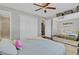 This bright bedroom has a comfortable bed and access to an ensuite bathroom and closet at 3420 Arnel Dr, Winter Park, FL 32792