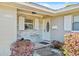 Inviting front entrance with a brick accent wall and a white front door at 3420 Arnel Dr, Winter Park, FL 32792