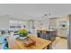 Open floor plan featuring a view of kitchen with island seating and a cozy living room area at 3420 Arnel Dr, Winter Park, FL 32792