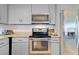 Bright kitchen with stainless steel appliances, white subway tile backsplash, and granite countertops at 3420 Arnel Dr, Winter Park, FL 32792