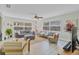 A bright living room featuring neutral colors, large windows, and plenty of seating for entertaining at 3420 Arnel Dr, Winter Park, FL 32792