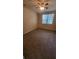 Bedroom featuring neutral carpeting, a ceiling fan, and natural light at 3433 Soho St # 101, Orlando, FL 32835