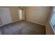 Bedroom with carpet, window, and a view to another room at 3433 Soho St # 101, Orlando, FL 32835