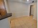 Dining area with tile flooring and access to kitchen area at 3433 Soho St # 101, Orlando, FL 32835