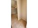View of the tiled entry foyer leading into a spacious living area with a ceiling fan at 3433 Soho St # 101, Orlando, FL 32835