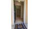 Open doorway revealing a tiled foyer and glimpse into the spacious, light-filled interior of the home at 3433 Soho St # 101, Orlando, FL 32835