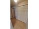 Hallway featuring tile floors and a set of double doors at 3433 Soho St # 101, Orlando, FL 32835