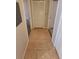 Hallway with tile flooring and doors to other rooms at 3433 Soho St # 101, Orlando, FL 32835